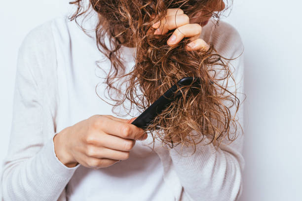 How do I restore a natural curl pattern to heat damaged hair?