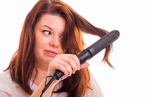 Is blow drying hair as bad as straightening it?